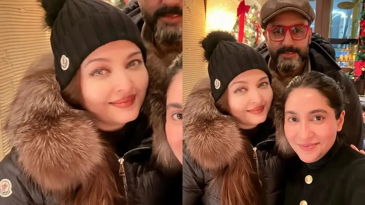 aishwarya rai and abhishek bachchan poses with a fan 1767257173290 16 9
